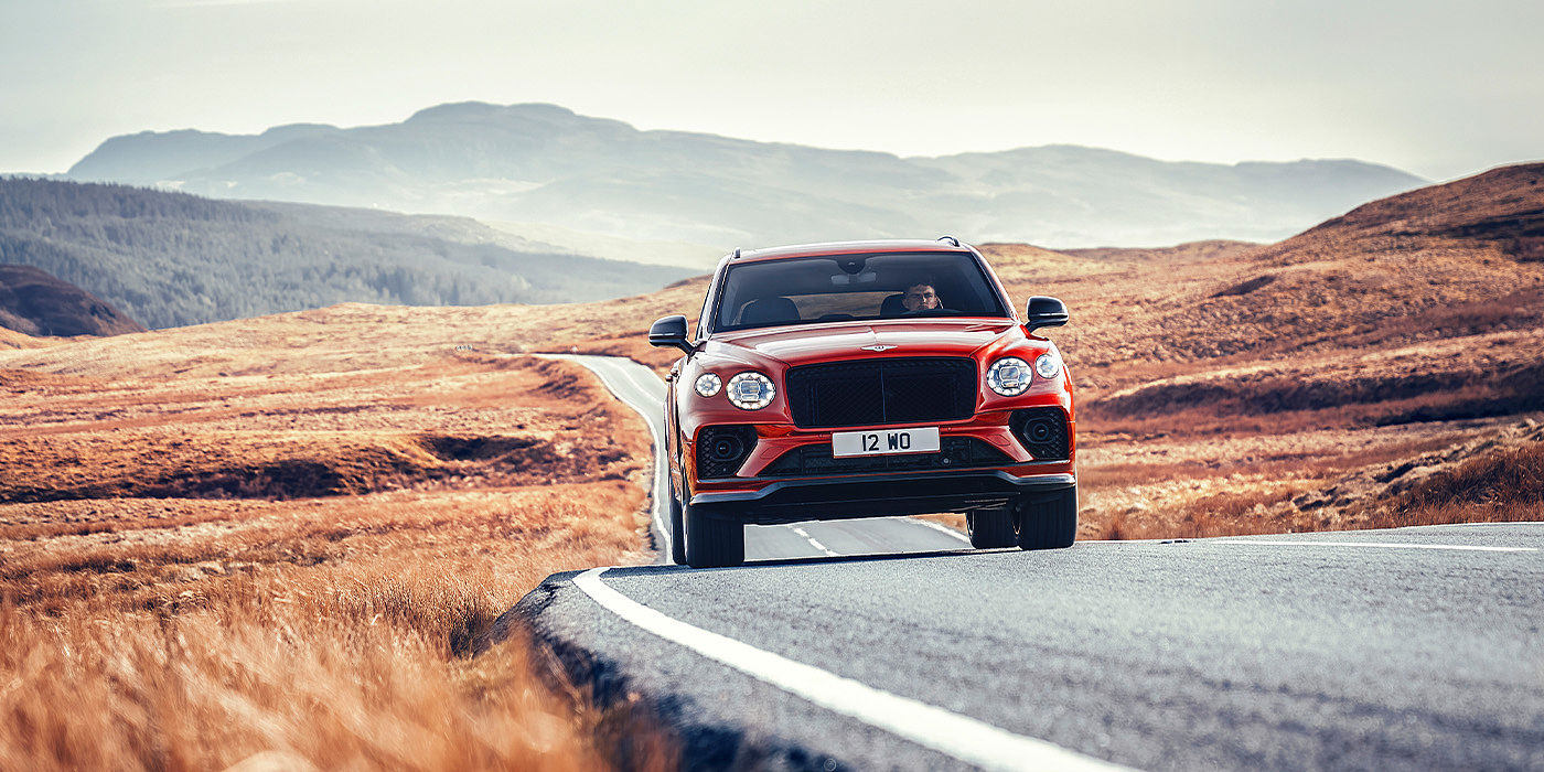 Emil Frey Exclusive Cars GmbH | Bentley Nürnberg Bentley Bentayga S SUV in Candy Red paint full front dynamic