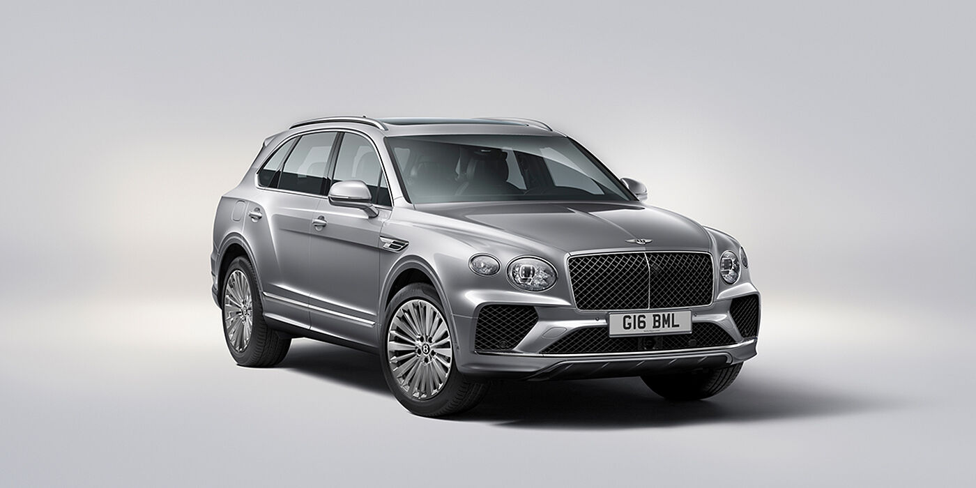 Feser-Graf Exclusive Cars GmbH | Bentley Nürnberg Bentley Bentayga luxury SUV front three quarter view in Moonbeam paint with matrix grille and 21″ 5 spoke painted wheels
