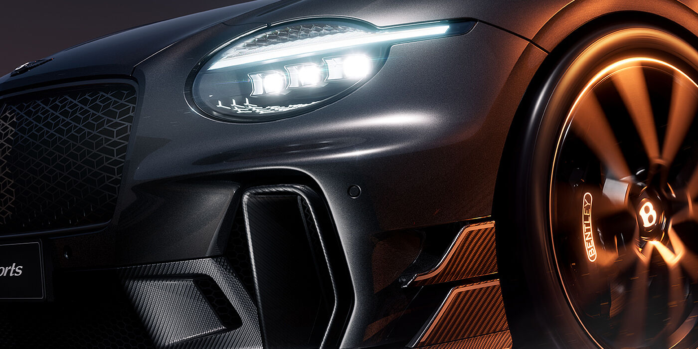 Feser-Graf Exclusive Cars GmbH | Bentley Nürnberg Bentley Supersports front three quarter headlamp and lower grille detail in "Nightfall" design theme with Anthracite paint, Camel accents and Camel and Beluga Black striping