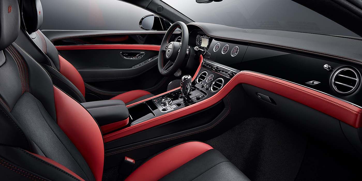 Emil Frey Exclusive Cars GmbH | Bentley Nürnberg Bentley Continental GT S coupe front interior in Beluga black and Hotspur red hide with high gloss Carbon Fibre veneer