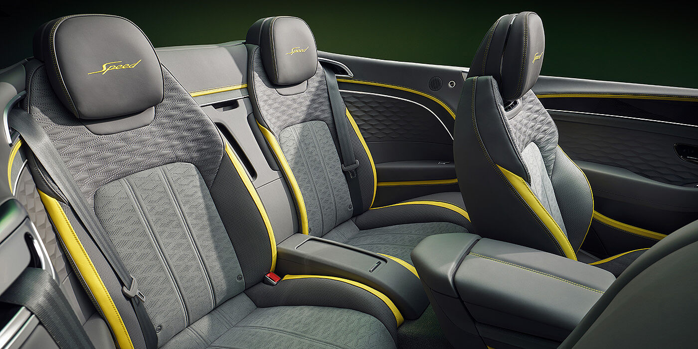 Feser-Graf Exclusive Cars GmbH | Bentley Nürnberg Bentley New Continental GTC Speed convertible rear interior with unique Speed colour split in Gravity Grey and Cyber Yellow hide colours, and contrast stitched headrest emblems 