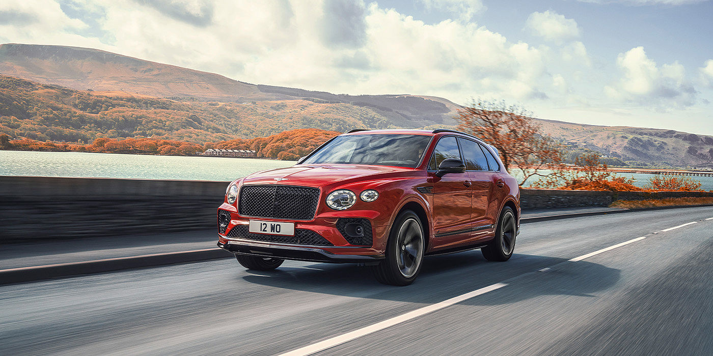Emil Frey Exclusive Cars GmbH | Bentley Nürnberg Bentley Bentayga S SUV in Candy Red paint front 34 dynamic