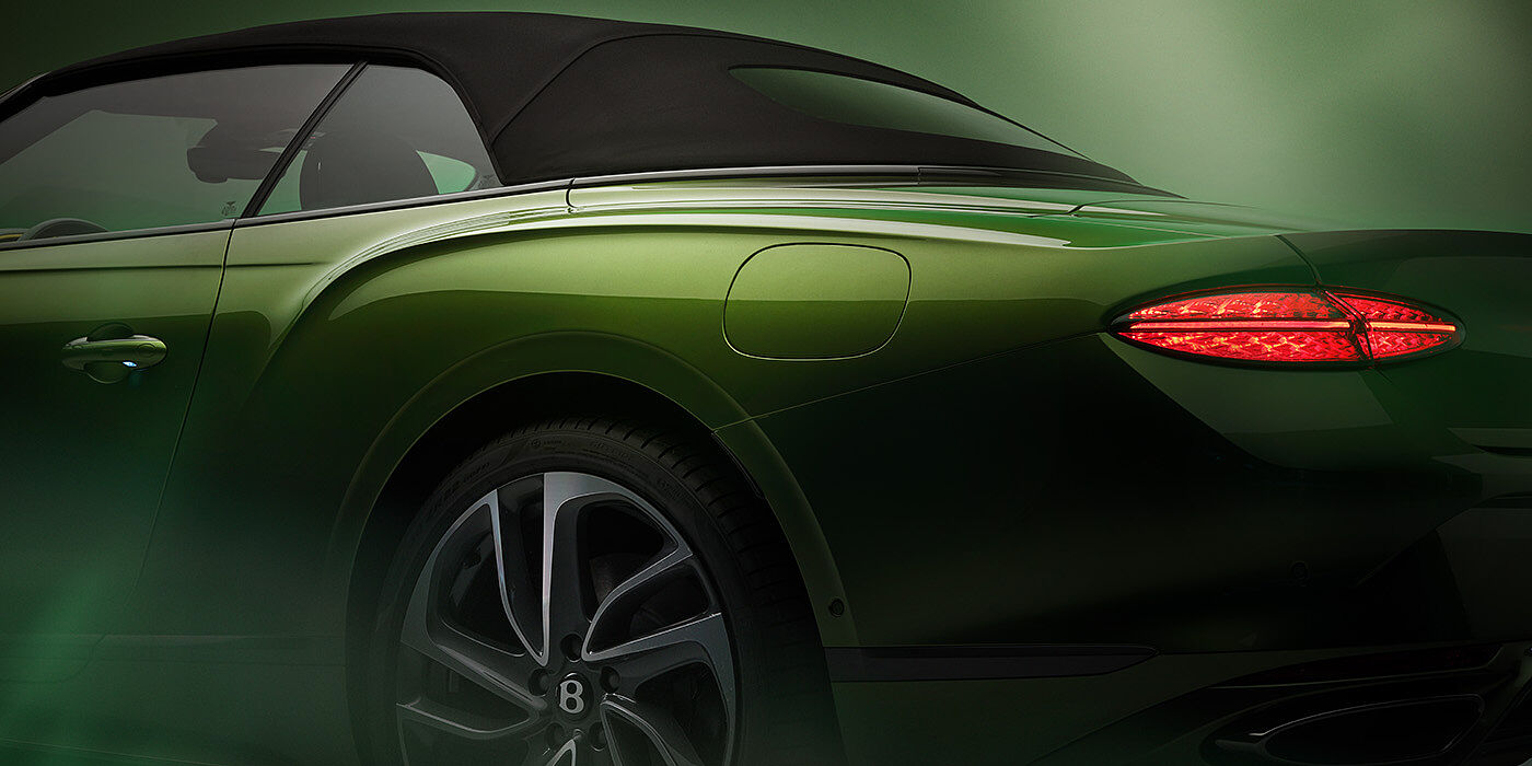 Feser-Graf Exclusive Cars GmbH | Bentley Nürnberg Bentley New Continental GTC Speed rear haunch and tail lamp in Tourmaline Green paint and dark tint brightware with black hood up and illuminated head lamps