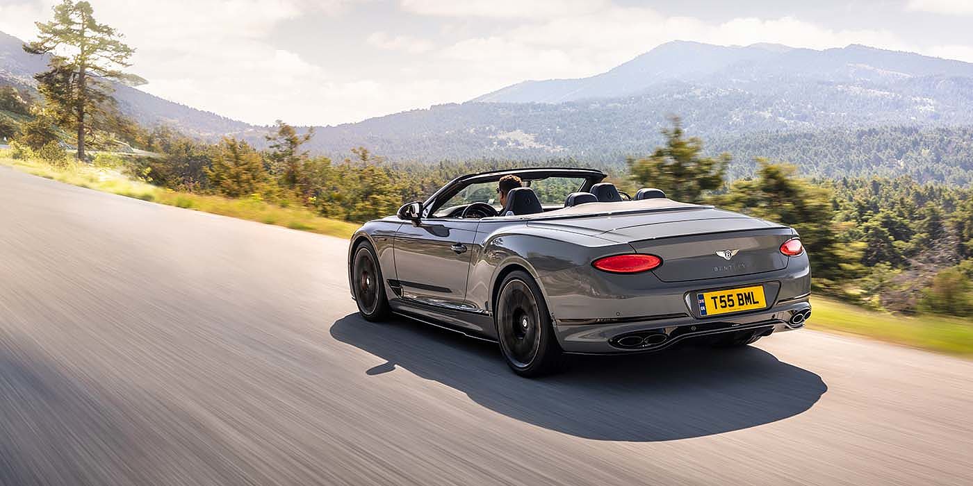 Emil Frey Exclusive Cars GmbH | Bentley Nürnberg Bentley Continental GTC S convertible in Cambrian Grey paint rear 34 dynamic driving