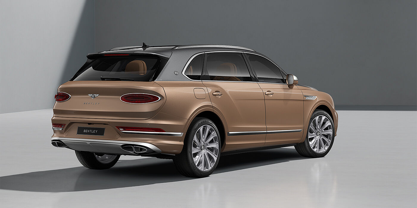 Feser-Graf Exclusive Cars GmbH | Bentley Nürnberg Bentley Bentayga EWB Mulliner SUV in Magnetic and Rose Gold paint and 22" Mulliner wheels rear ¾