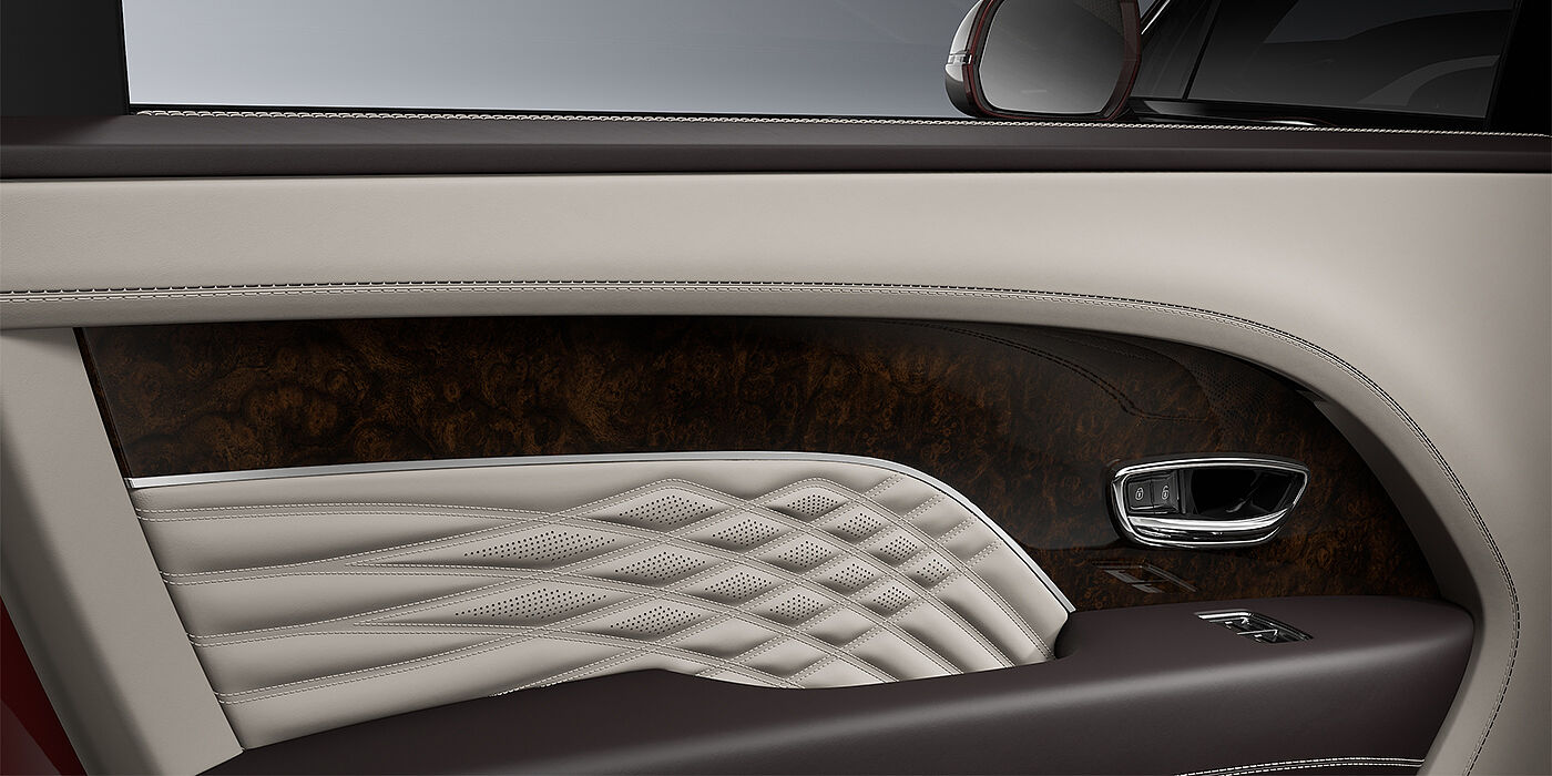 Feser-Graf Exclusive Cars GmbH | Bentley Nürnberg Bentley Bentayga EWB Azure SUV door interior detail in Linen and Burnt Oak hides with Dark Stained Burr Walnut veneer