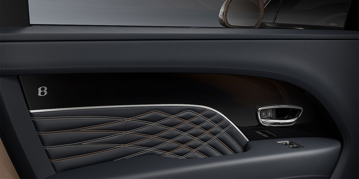 Feser-Graf Exclusive Cars GmbH | Bentley Nürnberg Bentley Bentayga EWB Mulliner SUV door interior detail in Brunel hide and Grand Black veneer with Mulliner contrast stitching