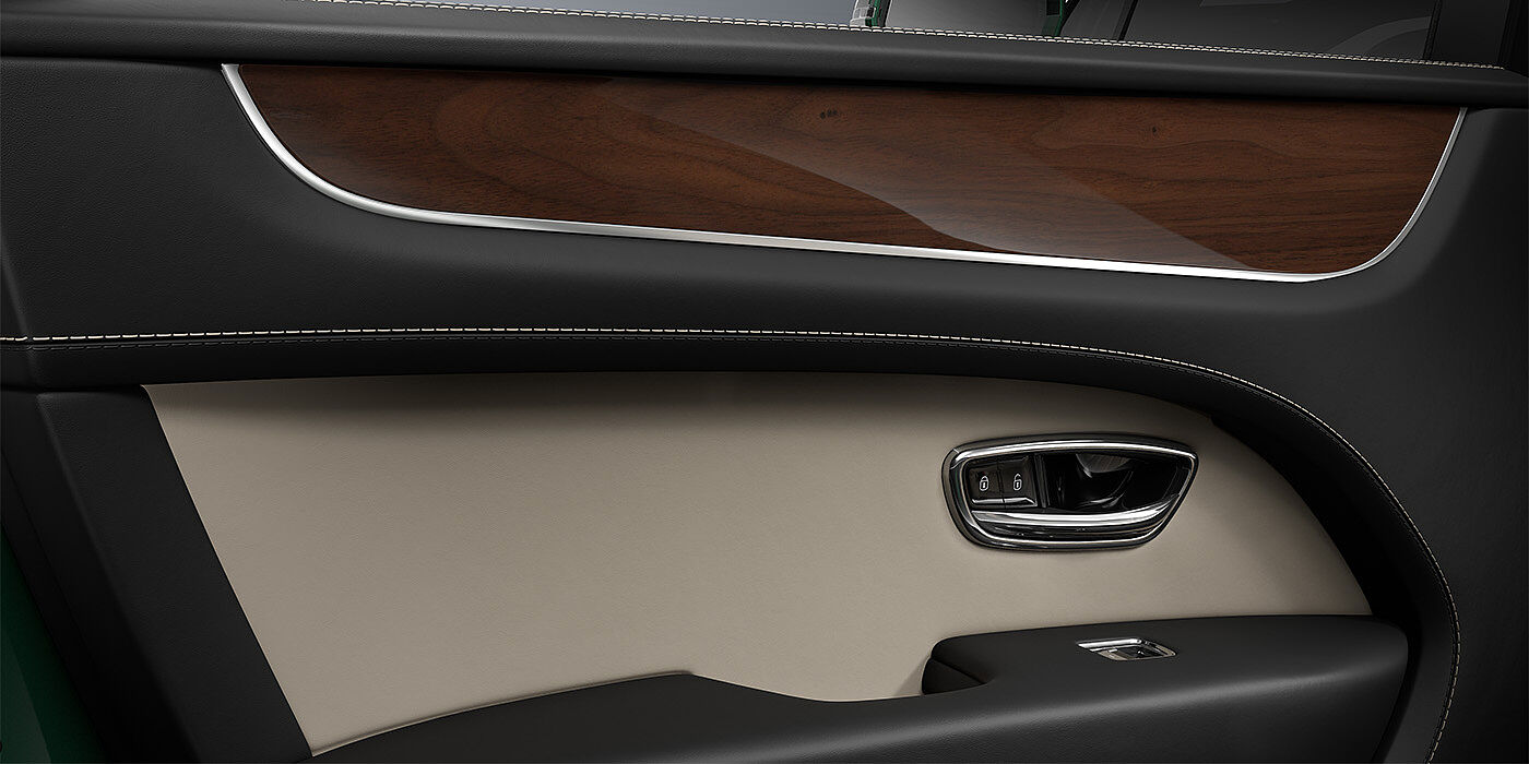 Feser-Graf Exclusive Cars GmbH | Bentley Nürnberg Bentley Bentayga SUV door interior detail in Portland and Beluga black hides with Crown Cut Walnut veneer