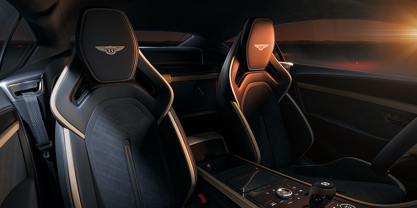 Feser-Graf Exclusive Cars GmbH | Bentley Nürnberg Bentley Supersports rear interior with Supersports seats in Camel and Beluga black hides hide and high gloss carbon fibre veneer