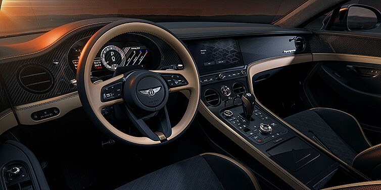 Feser-Graf Exclusive Cars GmbH | Bentley Nürnberg Bentley Supersports front interior in Beluga and Camel hides with Bronze accents and high gloss black carbon fibre veneer.