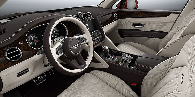Feser-Graf Exclusive Cars GmbH | Bentley Nürnberg Bentley Bentayga EWB Azure SUV front interior in Linen and Burnt Oak hides with Dark Stained Burr Walnut veneer