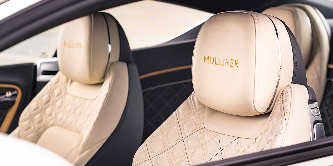 Emil Frey Exclusive Cars GmbH | Bentley Nürnberg Bentley Continental GT Mulliner coupe seat detail in Beluga black and Linen hide