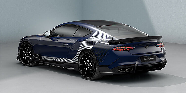Feser-Graf Exclusive Cars GmbH | Bentley Nürnberg Bentley Supersports rear three quarter in "Skies" Design theme with Electric Blue paint finish and Arctica white and Oxford blue paint stripes across the rear haunch.