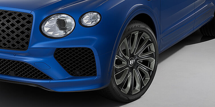 Feser-Graf Exclusive Cars GmbH | Bentley Nürnberg Bentley Bentayga Artenara Edition SUV front detail in Sequin Blue paint and 22" Mulliner Gloss Black wheels front 3/4