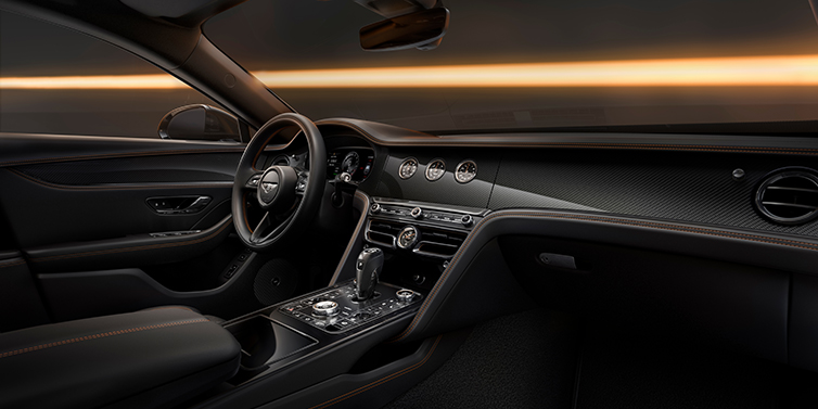Feser-Graf Exclusive Cars GmbH | Bentley Nürnberg Bentley Flying Spur Black Edition sedan front interior in Beluga black hide with High Gloss Carbon Fibre veneer