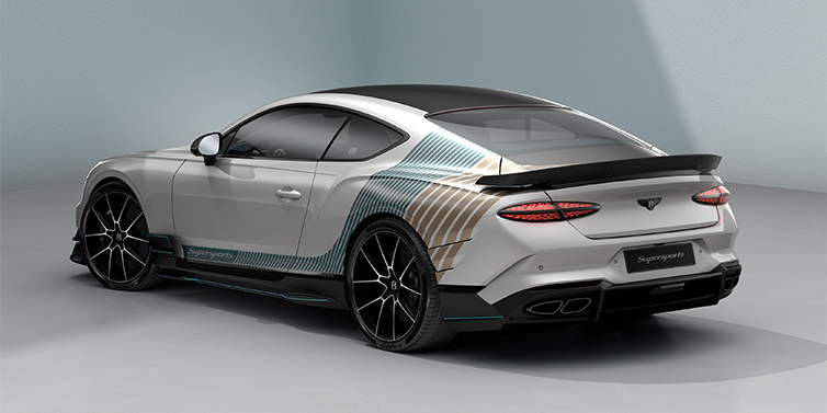 Feser-Graf Exclusive Cars GmbH | Bentley Nürnberg Bentley Supersports rear three quarter in "Snowstorm" Design theme with Snow Quartz paint and Topaz blue and Camel brown paint stripes across the rear haunch.