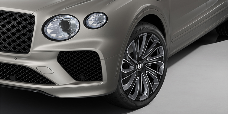 Feser-Graf Exclusive Cars GmbH | Bentley Nürnberg Bentayga EWB Artenara Edition SUV in Pale Brodgar paint with 22" Mulliner Gloss black wheel close up