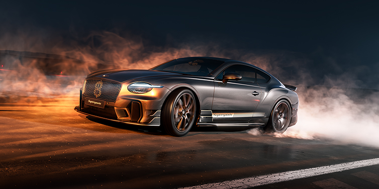 Feser-Graf Exclusive Cars GmbH | Bentley Nürnberg Bentley Supersports front three quarter in "Nightfall" Design theme with Anthracite paint, Camel accents and Camel and Beluga black striping standing on mist covered concrete
