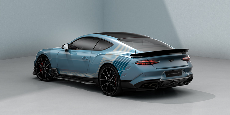 Feser-Graf Exclusive Cars GmbH | Bentley Nürnberg Bentley Supersports rear three quarter in "Daybreak" Design theme with Jetstream blue paint and Arctica white and Portofino blue paint stripes across the rear haunch.