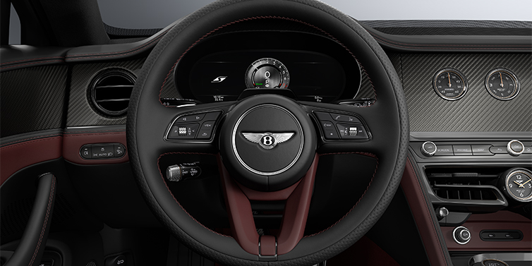 Feser-Graf Exclusive Cars GmbH | Bentley Nürnberg New Bentley Flying Spur S sedan steering wheel and dash in Cricket Ball red and Beluga black hides and High Gloss Carbon Fibre veneer