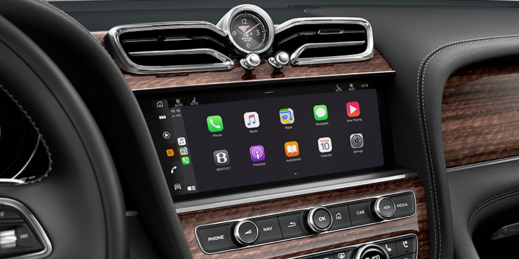 Feser-Graf Exclusive Cars GmbH | Bentley Nürnberg Bentley Bentayga Extended Wheelbase SUV front interior centre console MMI screen showing apps surrounded by Beluga black hide and Crown Cut Walnut veneer