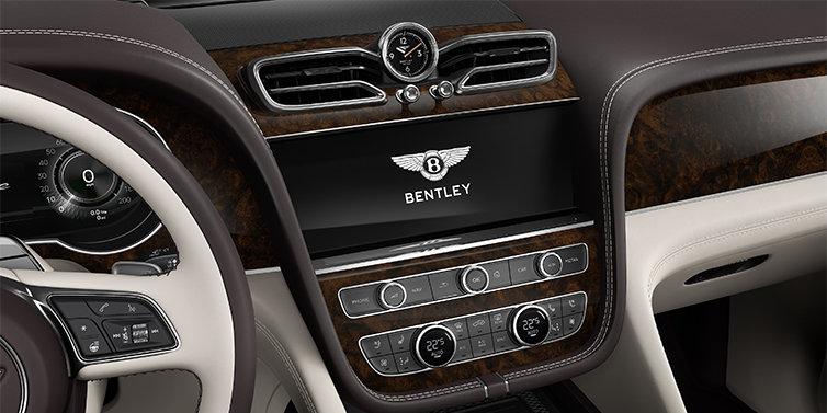 Feser-Graf Exclusive Cars GmbH | Bentley Nürnberg Bentley Bentayga EWB Azure SUV centre console detail showing Bentley Wings