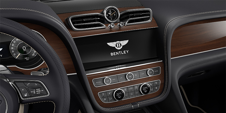 Feser-Graf Exclusive Cars GmbH | Bentley Nürnberg Bentley Bentayga EWB SUV centre console detail showing Bentley Wings